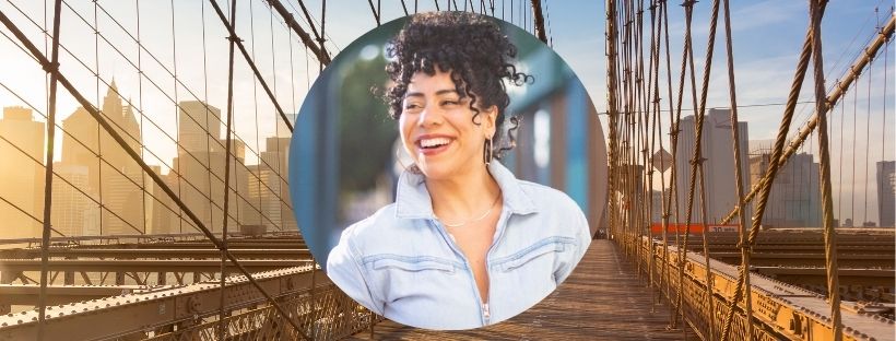 Shirin Eskandani smiling, Brooklyn Bridge in the background